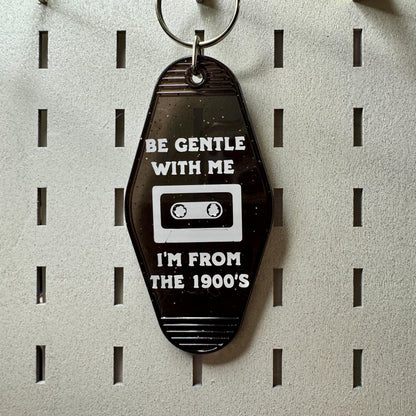 Be gentle with me I'm from the 1900s - black glitter motel style keychain