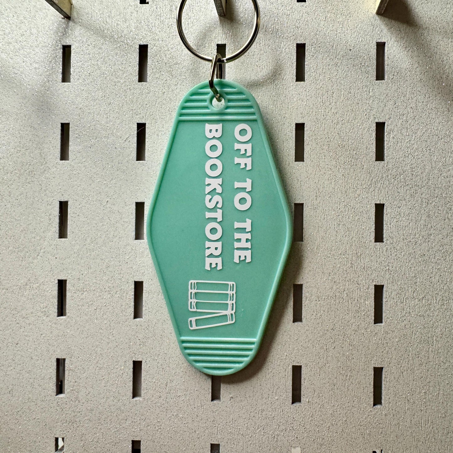 Off to the bookstore - Motel Keychain
