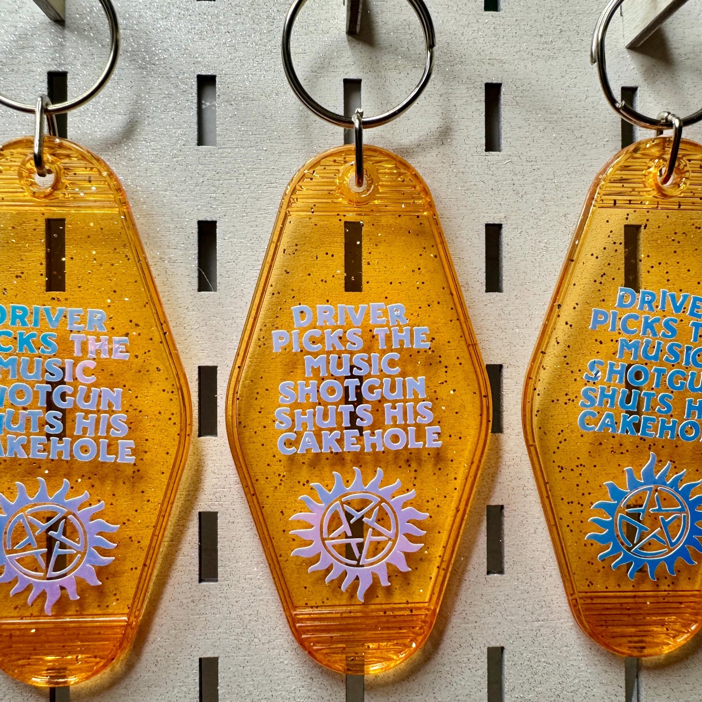 Driver picks the music shotgun shuts his cakehole - Supernatural Keyring Motel Style glitter