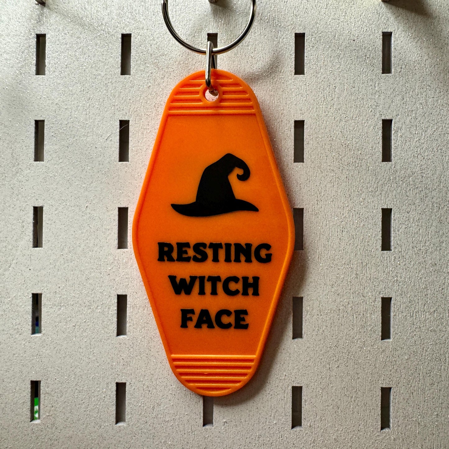 Resting Witch Face - Orange Motel style keyring