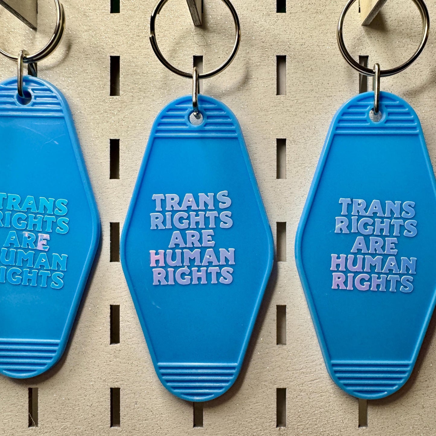 Trans rights are human rights - Blue motel style keyring holographic text